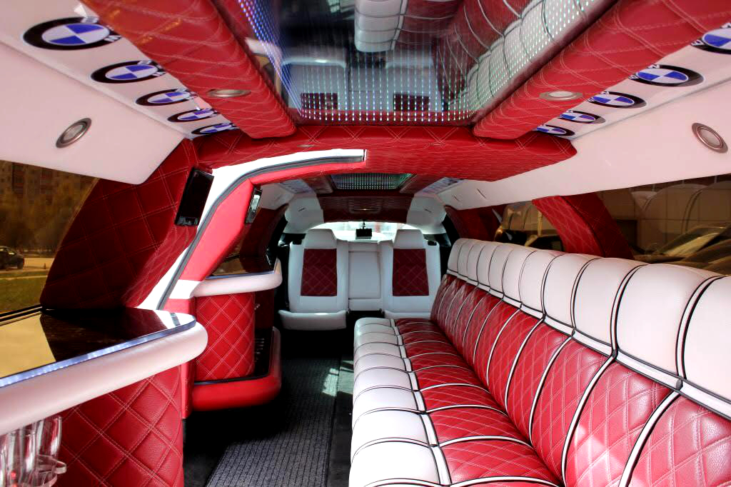 15 passenger BMW X6 stretch limousine rent Warsaw Airport
                    interior